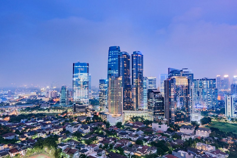 Jakarta city skyline with urban skyscrapers at night. Jakarta, Indonesia